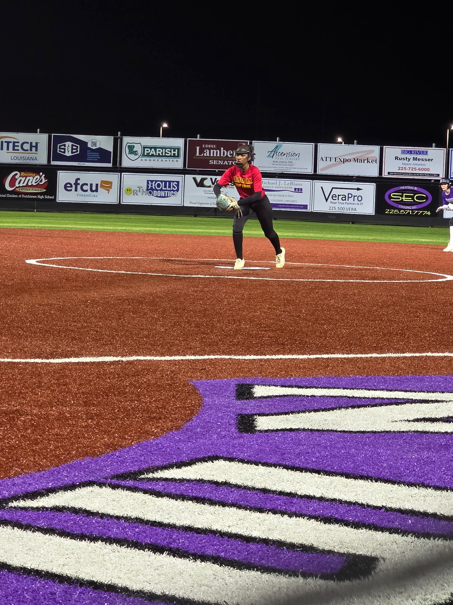 Skye Hebert standing tall on the mound under the lights
