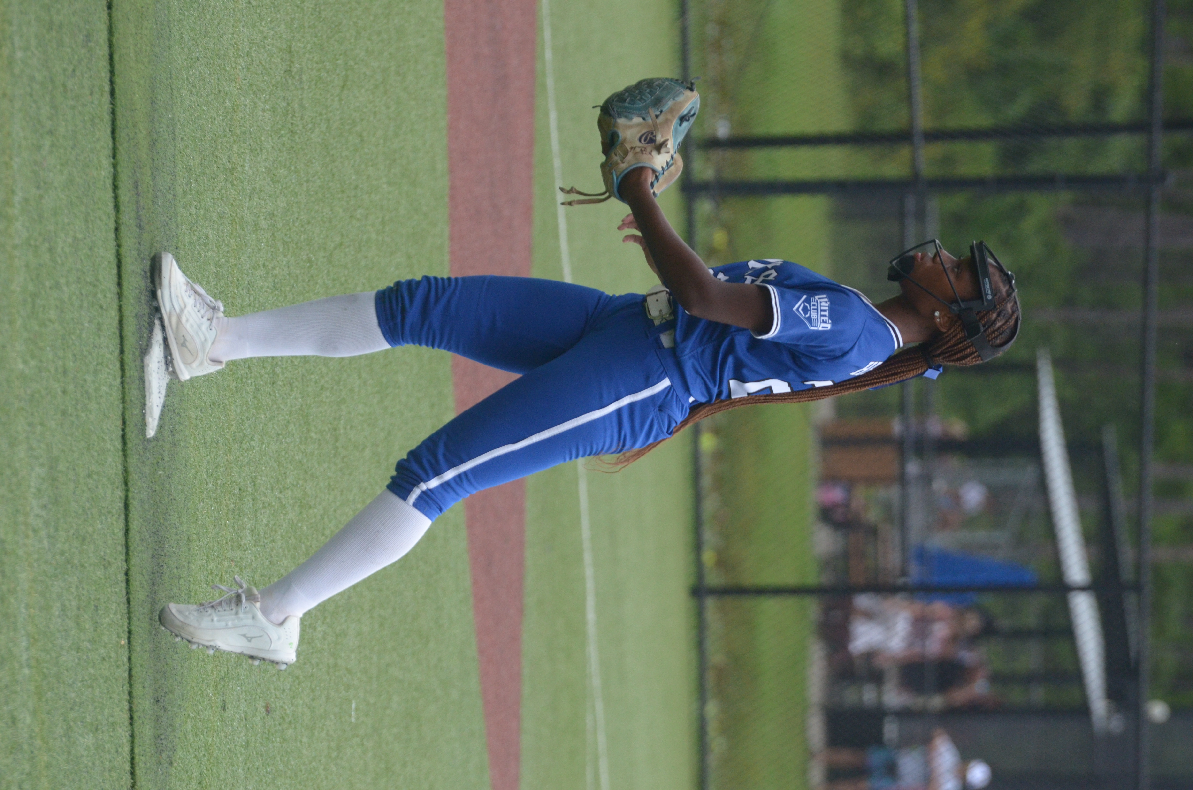 Skye Hebert walking the mound between pitches in Lady Dukes blue